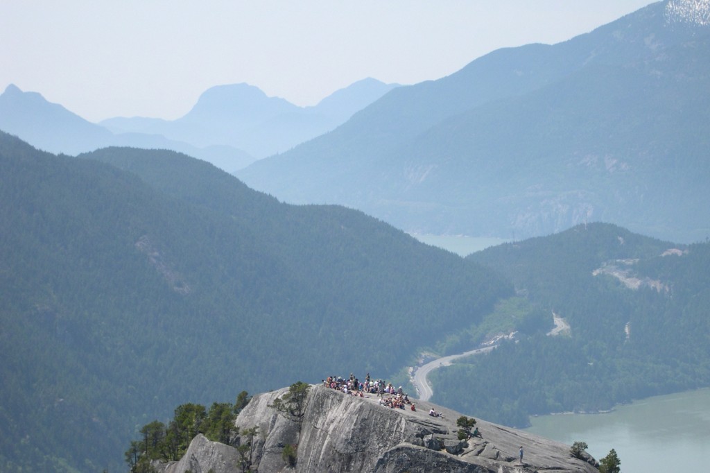 The iconic granite cliffs of Stawamus Chief Provincial Park towering over the town of Squamish on a clear day.
