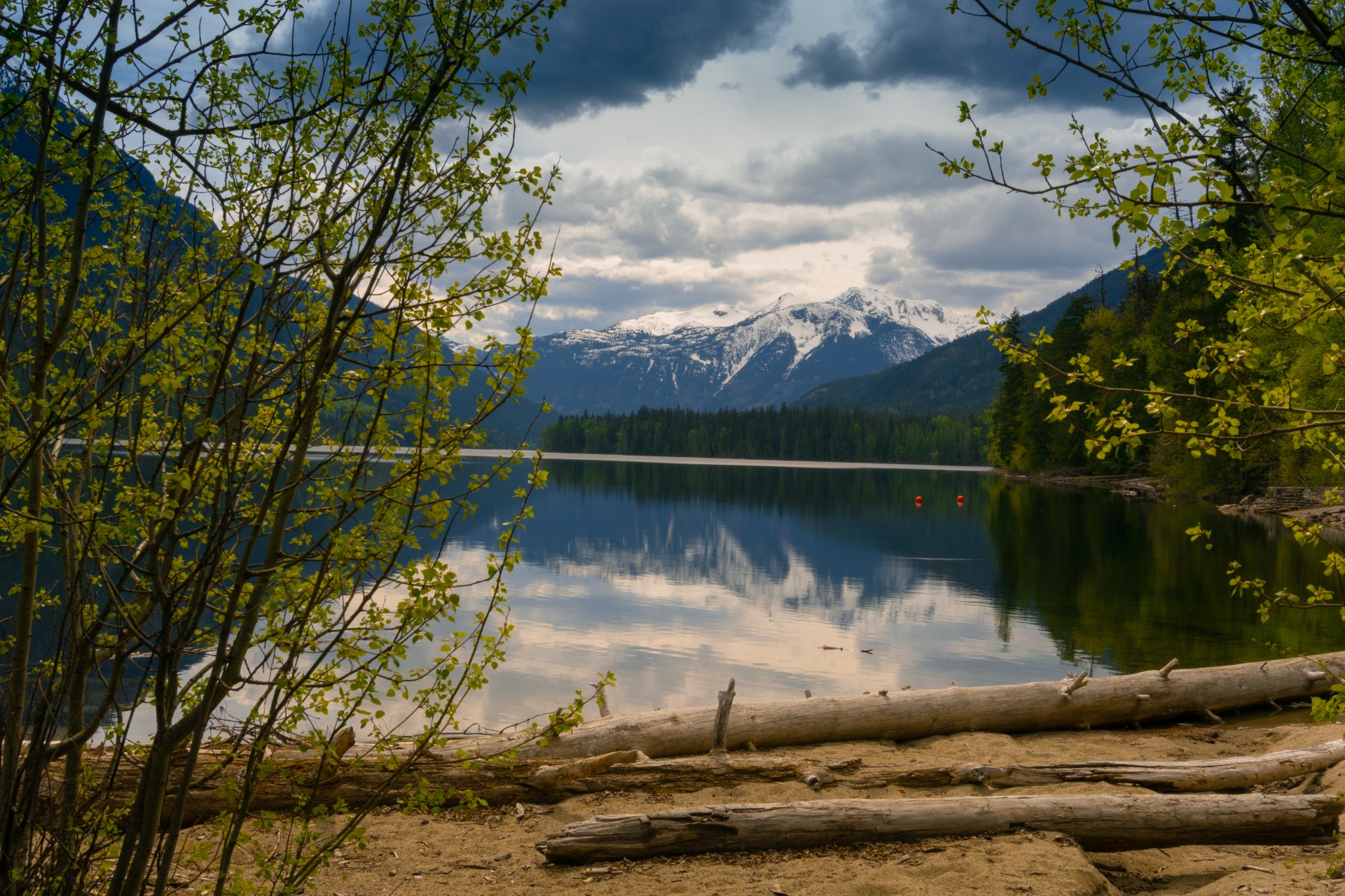 Birkenhead Lake with a snow covered mountain in the background.