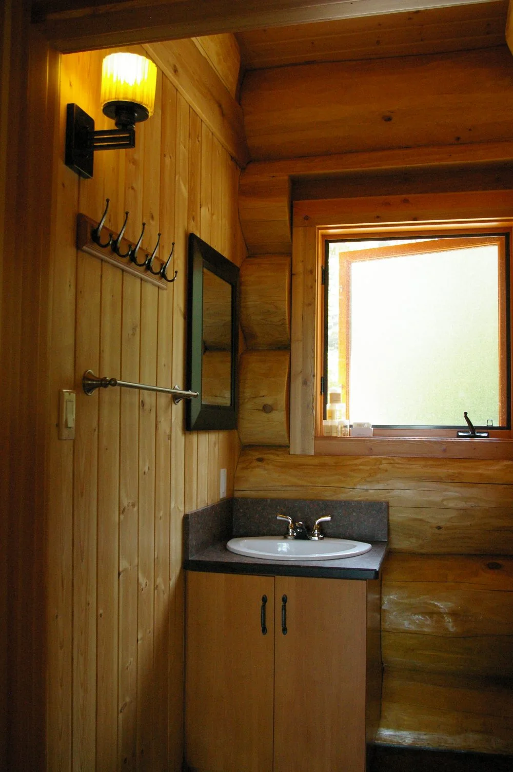 Bright bathroom facility within our cabin, combining rustic charm with modern comfort.